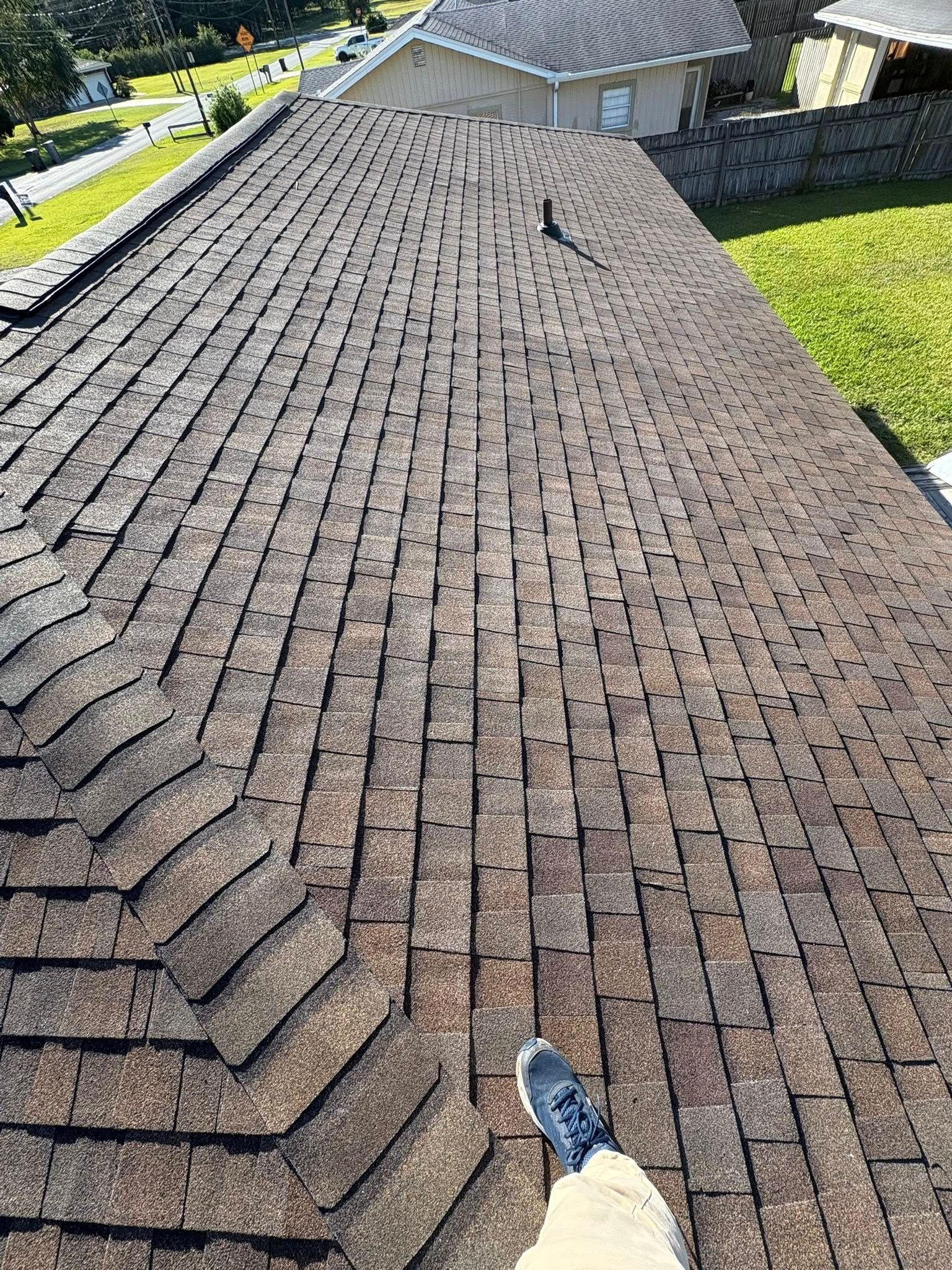 Defender Roofing inspector performing a roof inspection in Fort Walton Beach, FL